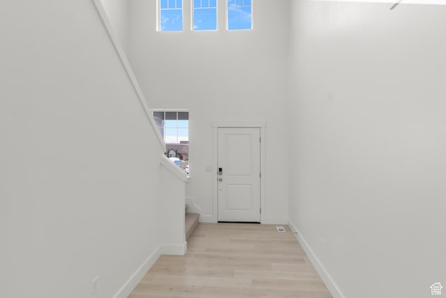 556 N 800 W, Smithfield, UT 84335 - entrance foyer featuring stairway, baseboards, a high ceiling, and light wood-type flooring