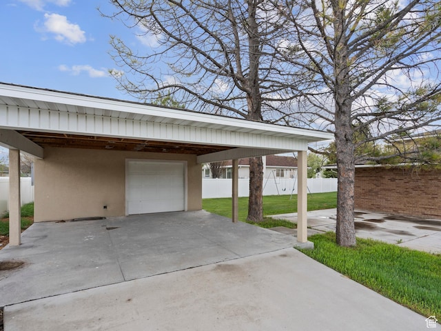 exterior space with a garage and fence