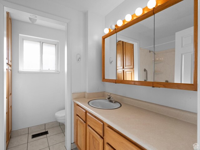 full bath with visible vents, tile patterned floors, vanity, and toilet
