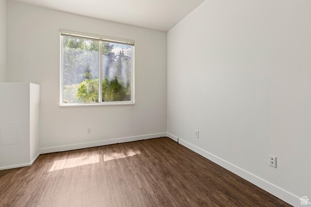 1600 W Pinebrook Blvd Unit C2, Park City, UT 84098 - empty room with dark wood-style floors and baseboards
