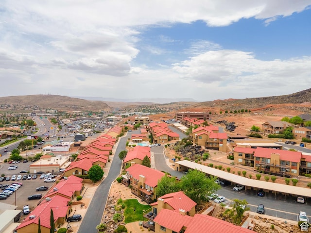 birds eye view of property with a mountain view and a residential view
