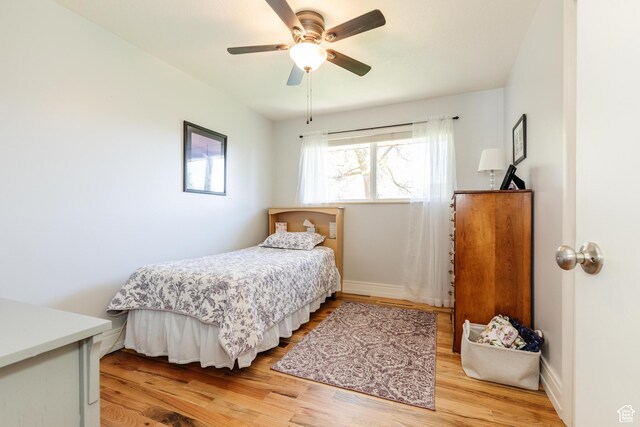 1550 E 2100 N, North Logan, UT 84341 - bedroom with baseboards, light wood-style floors, and ceiling fan