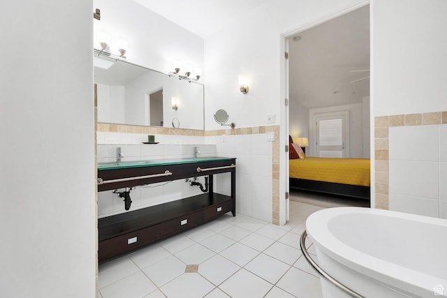 1999 W Canyon Dr Unit 3, St George, UT 84770 - ensuite bathroom featuring a bathtub, tile walls, a wainscoted wall, ensuite bath, and tile patterned flooring