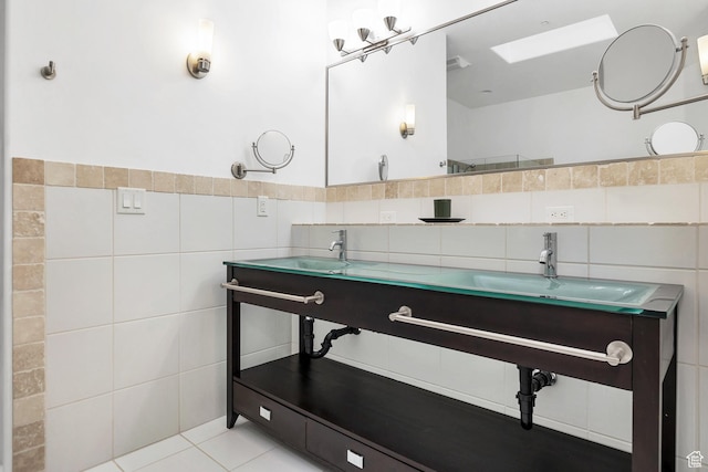 1999 W Canyon Dr Unit 3, St George, UT 84770 - bathroom with tile walls, tile patterned floors, a skylight, and a sink