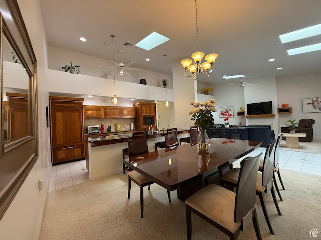 1999 W Canyon Dr Unit 3, St George, UT 84770 - dining area with light colored carpet, ceiling fan with notable chandelier, and a skylight
