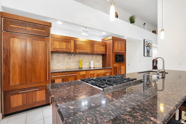 1999 W Canyon Dr Unit 3, St George, UT 84770 - kitchen featuring a sink, brown cabinetry, decorative backsplash, built in appliances, and decorative light fixtures