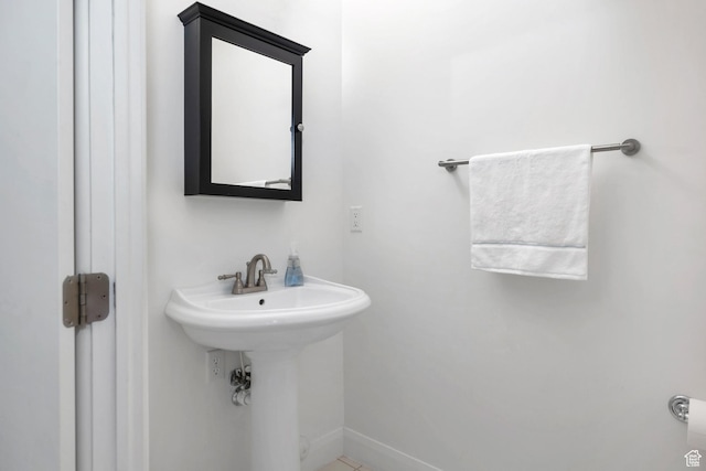 1999 W Canyon Dr Unit 3, St George, UT 84770 - bathroom featuring baseboards and a sink