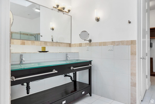 1999 W Canyon Dr Unit 3, St George, UT 84770 - bathroom with tile patterned floors, a shower with door, a sink, and tile walls