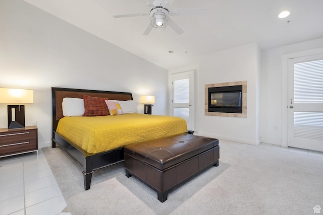 1999 W Canyon Dr Unit 3, St George, UT 84770 - bedroom featuring tile patterned floors, a tiled fireplace, vaulted ceiling, baseboards, and a ceiling fan