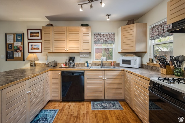 168 S 100 W, Moab, UT 84532 - kitchen with light brown cabinetry, light wood finished floors, a sink, and black appliances