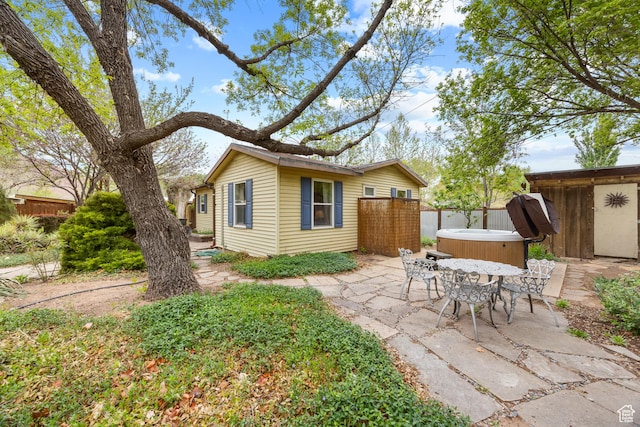 168 S 100 W, Moab, UT 84532 - exterior space with fence, an outbuilding, a hot tub, and a patio