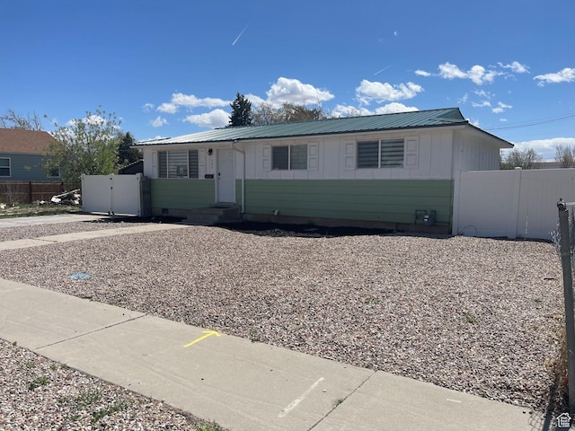 235 W 200 S, Vernal, UT 84078 - ranch-style house with fence, board and batten siding, and metal roof