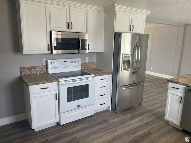 235 W 200 S, Vernal, UT 84078 - kitchen with dark countertops, baseboards, stainless steel appliances, and dark wood-style floors