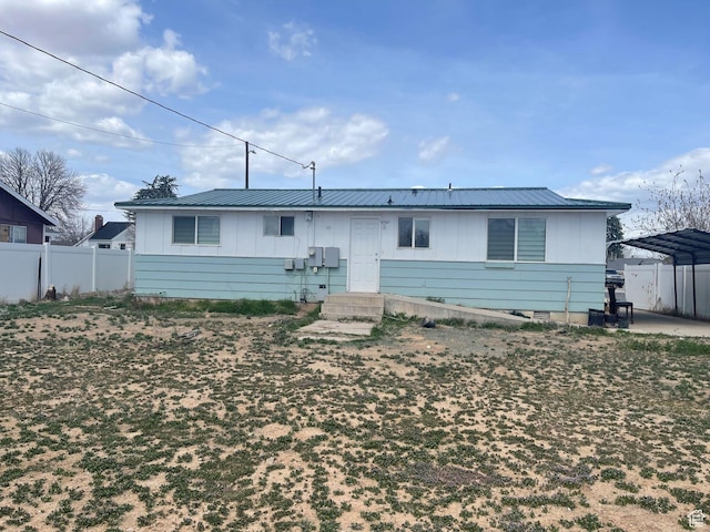 235 W 200 S, Vernal, UT 84078 - single story home with fence, board and batten siding, a carport, and metal roof
