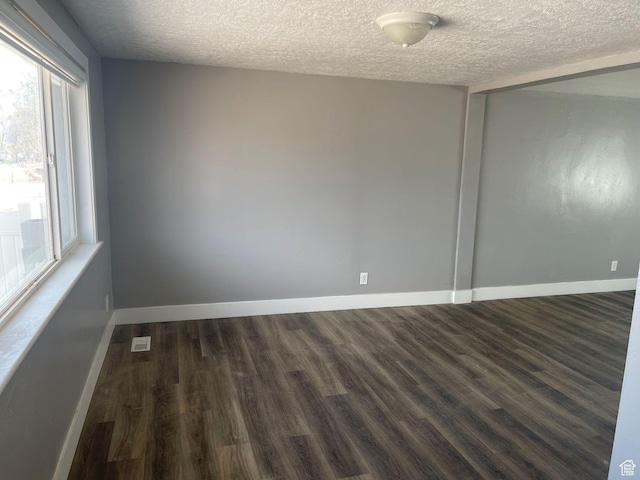 235 W 200 S, Vernal, UT 84078 - unfurnished room with baseboards, dark wood-style flooring, and a textured ceiling