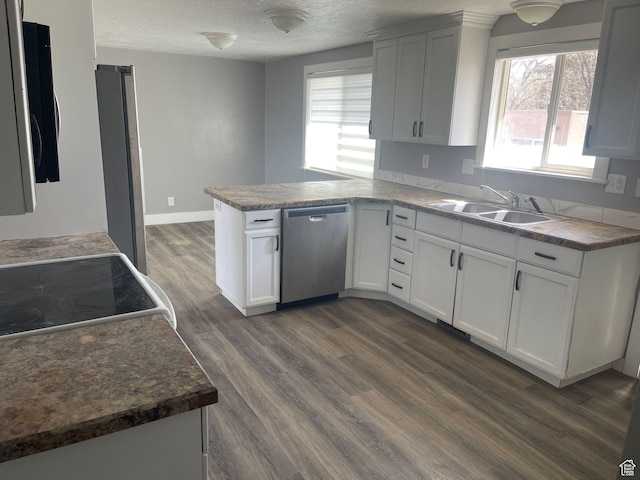 235 W 200 S, Vernal, UT 84078 - kitchen with a peninsula, a healthy amount of sunlight, stainless steel appliances, and a sink