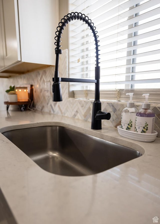 1394 S 1700 W, Vernal, UT 84078 - interior details with decorative backsplash, a sink, and light stone counters
