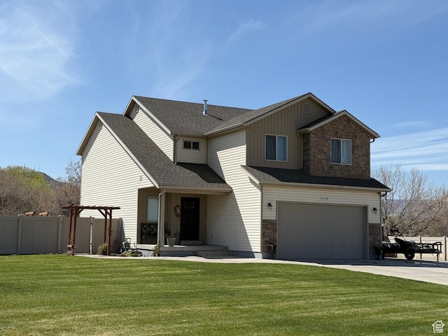 traditional home featuring concrete driveway, fence, stone siding, and a garage