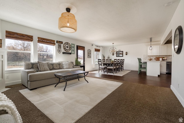 1394 S 1700 W, Vernal, UT 84078 - living room featuring baseboards, an inviting chandelier, and carpet