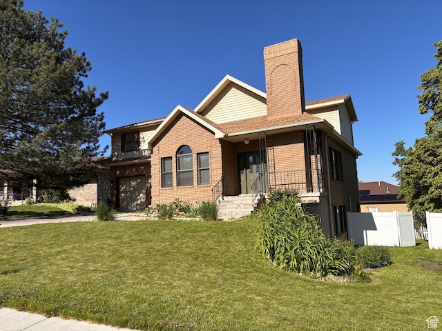 56 S 1000 E, Springville, UT 84663 - view of front facade featuring an attached garage, brick siding, and a chimney