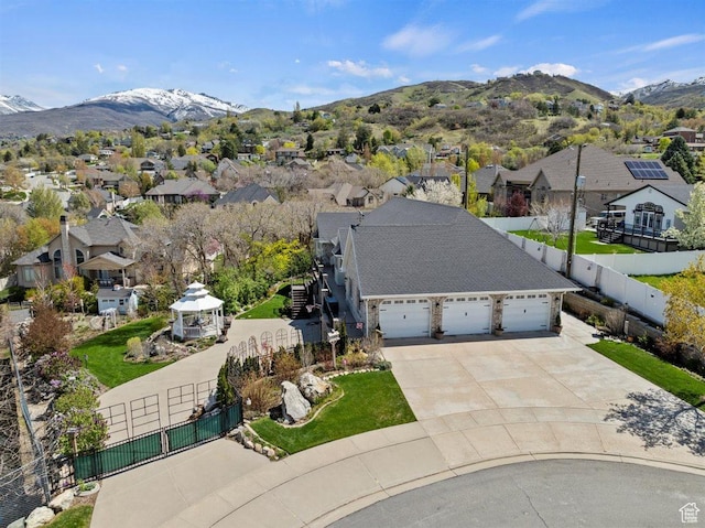 birds eye view of property with a residential view and a mountain view