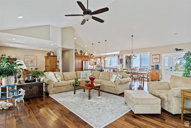 living area with recessed lighting, high vaulted ceiling, ceiling fan with notable chandelier, and dark wood-style floors