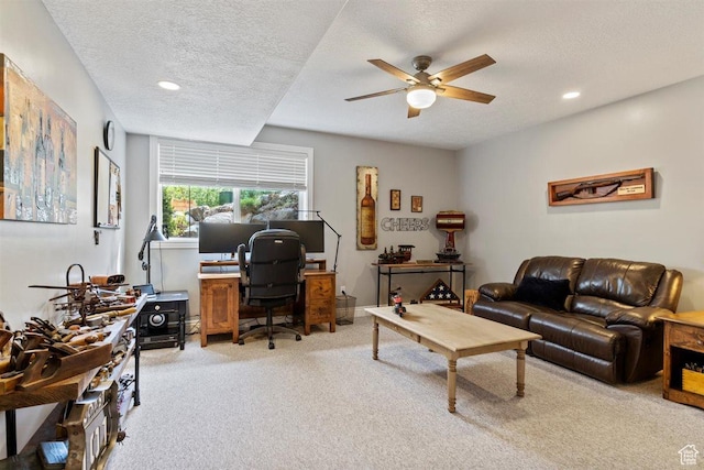 office area featuring a ceiling fan, a textured ceiling, recessed lighting, and carpet