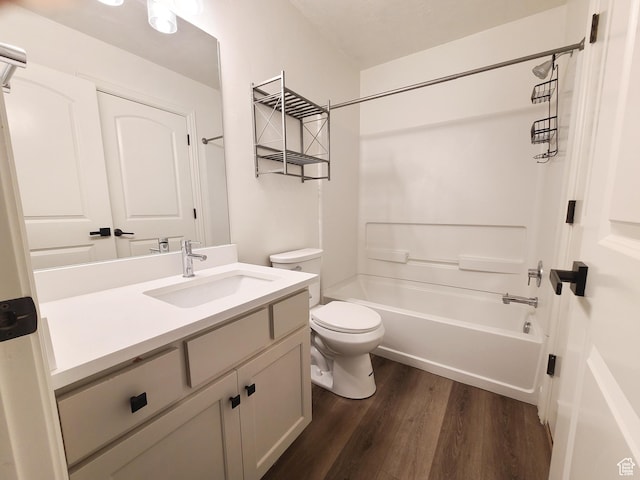 317 S 1000 W Unit 103, Pleasant Grove, UT 84062 - full bathroom with wood finished floors, toilet, vanity, and bathing tub / shower combination
