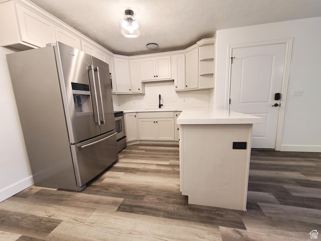 317 S 1000 W Unit 103, Pleasant Grove, UT 84062 - kitchen featuring open shelves, baseboards, stainless steel appliances, and dark wood-style floors