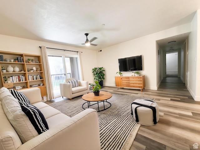 317 S 1000 W Unit 103, Pleasant Grove, UT 84062 - living room featuring baseboards, a ceiling fan, and wood finished floors