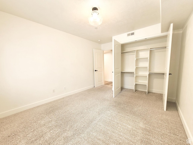 317 S 1000 W Unit 103, Pleasant Grove, UT 84062 - unfurnished bedroom featuring light carpet, baseboards, visible vents, and a closet