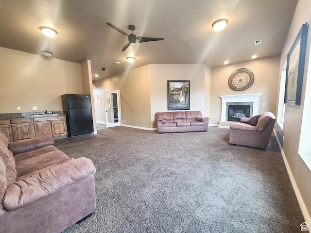 317 S 1000 W Unit 103, Pleasant Grove, UT 84062 - living room featuring a ceiling fan, a glass covered fireplace, baseboards, dark colored carpet, and visible vents