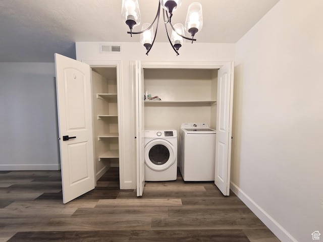 317 S 1000 W Unit 103, Pleasant Grove, UT 84062 - washroom featuring dark wood-style flooring, washing machine and dryer, visible vents, a notable chandelier, and laundry area
