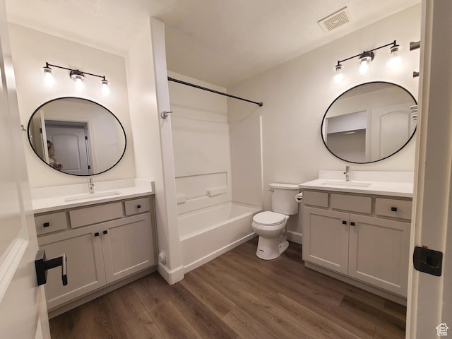 317 S 1000 W Unit 103, Pleasant Grove, UT 84062 - full bath featuring wood finished floors, visible vents, a sink, and toilet