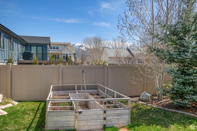 4423 Ranch Blvd, Mountain Green, UT 84050 - fenced backyard with a vegetable garden