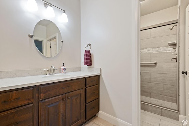 4423 Ranch Blvd, Mountain Green, UT 84050 - bathroom featuring vanity, a stall shower, tile patterned flooring, and baseboards