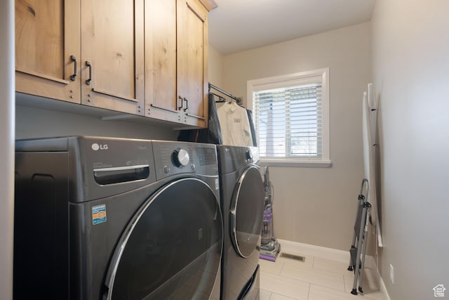 4423 Ranch Blvd, Mountain Green, UT 84050 - washroom with cabinet space, washer and dryer, baseboards, and tile patterned flooring