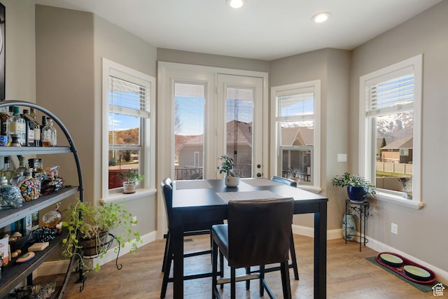 4423 Ranch Blvd, Mountain Green, UT 84050 - dining room with wood finished floors, plenty of natural light, baseboards, and recessed lighting