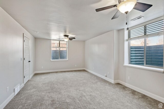 4423 Ranch Blvd, Mountain Green, UT 84050 - empty room featuring a ceiling fan, carpet floors, and plenty of natural light