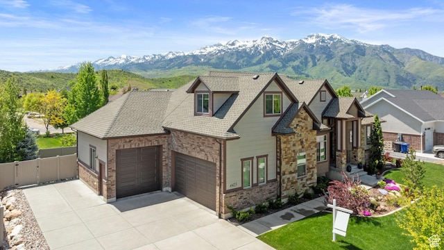 4423 Ranch Blvd, Mountain Green, UT 84050 - view of front of house with a mountain view, driveway, a garage, a gate, and brick siding