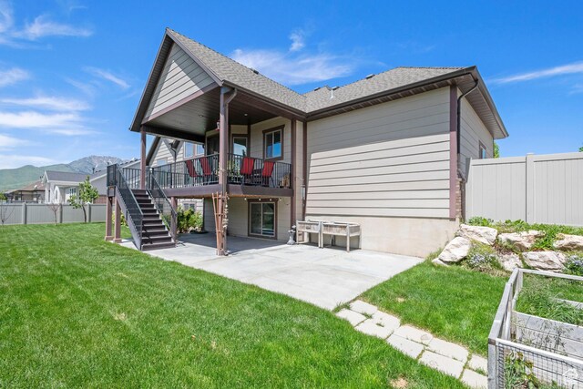 4423 Ranch Blvd, Mountain Green, UT 84050 - rear view of house featuring stairs, a patio area, and a mountain view