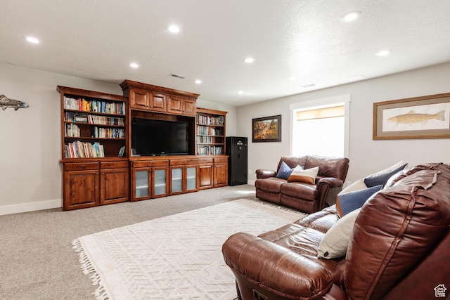 living area featuring light colored carpet, baseboards, and recessed lighting