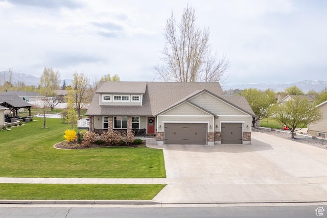 craftsman inspired home with concrete driveway, an attached garage, stone siding, and a front lawn