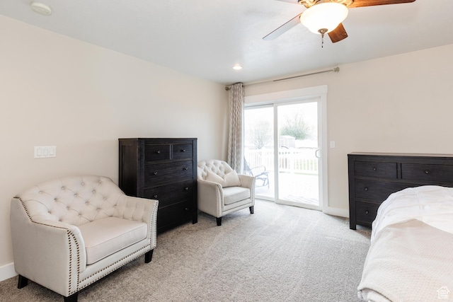 carpeted bedroom with access to exterior, a ceiling fan, and baseboards
