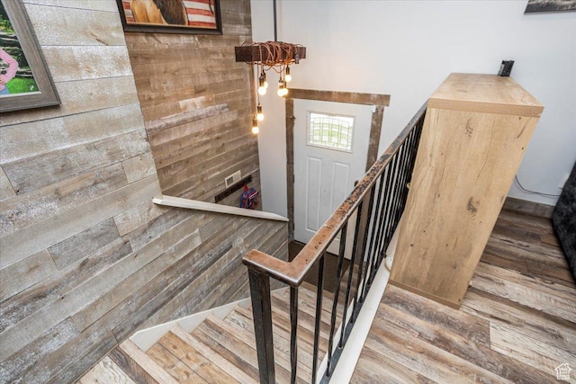 stairway featuring wood finished floors