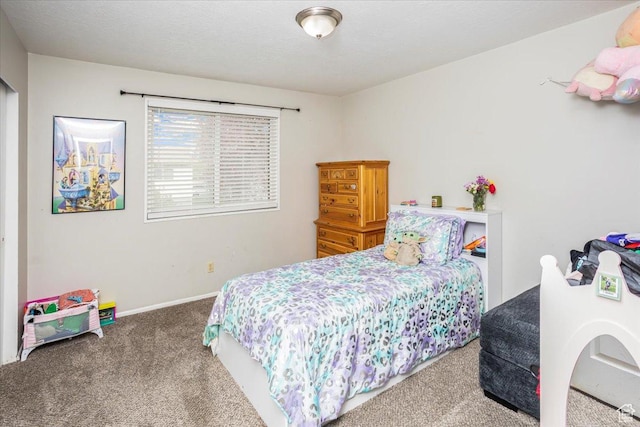 bedroom with baseboards and carpet flooring