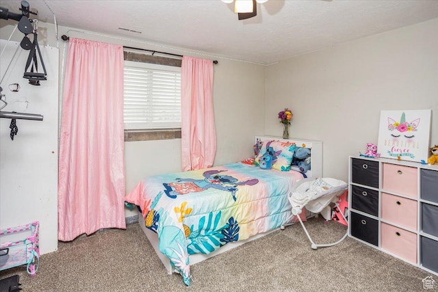 carpeted bedroom featuring a ceiling fan