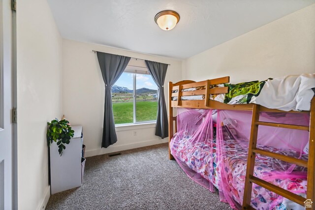 8050 W 1900 N, Petersboro, UT 84325 - carpeted bedroom featuring baseboards, a mountain view, and visible vents