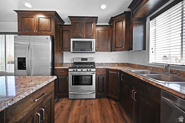 8050 W 1900 N, Petersboro, UT 84325 - kitchen featuring dark brown cabinetry, dark wood-type flooring, recessed lighting, a sink, and stainless steel appliances