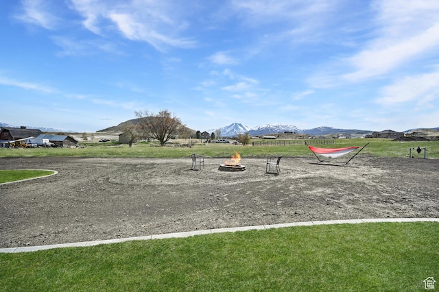 8050 W 1900 N, Petersboro, UT 84325 - view of play area featuring a mountain view and a fire pit
